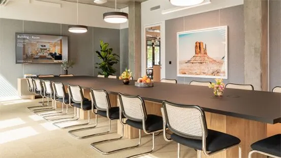 Dynamic Digital Signage playing on a display inside a WeWork conference room